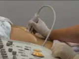nurse conducting a pancreas ultrasound