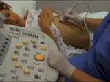 nurse conducting a urinary tract ultrasound 