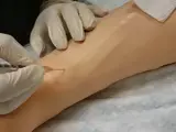 nurse performs an arterial blood gas procedure