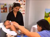 pediatrician assessing an infant