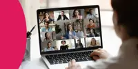 A laptop showing an online meeting